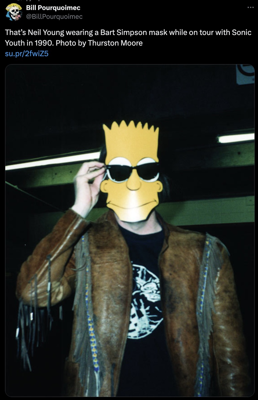 screenshot - Bill Pourquoimec That's Neil Young wearing a Bart Simpson mask while on tour with Sonic Youth in 1990. Photo by Thurston Moore su.pr2fwiZ5